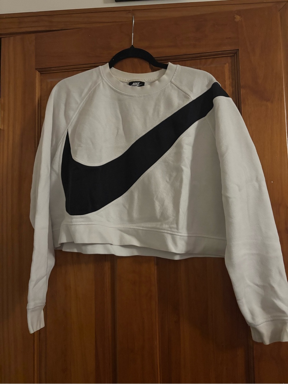 Nike White Cropped Sweatshirt with Oversized Black Swoosh